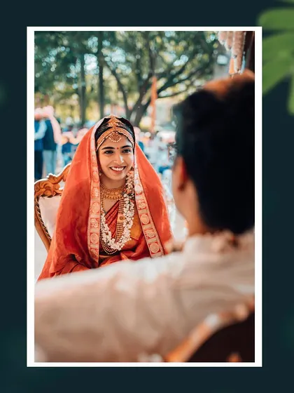 An over-the-shoulder view of the bride's loving gaze towards her groom during the wedding ceremony.