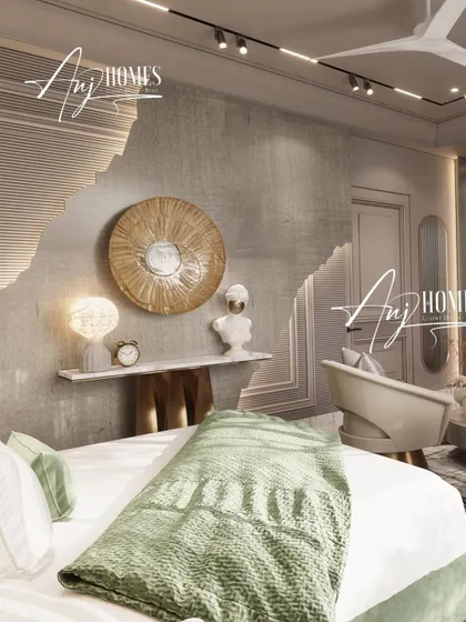 Texture plays a key role in making a neutral room feel rich and layered. Here, we used a combination of rough-textured wall finishes and smooth, curved panels to create a dynamic backdrop. The minimalist console and artistic decor add a touch of personality to this serene bedroom corner.