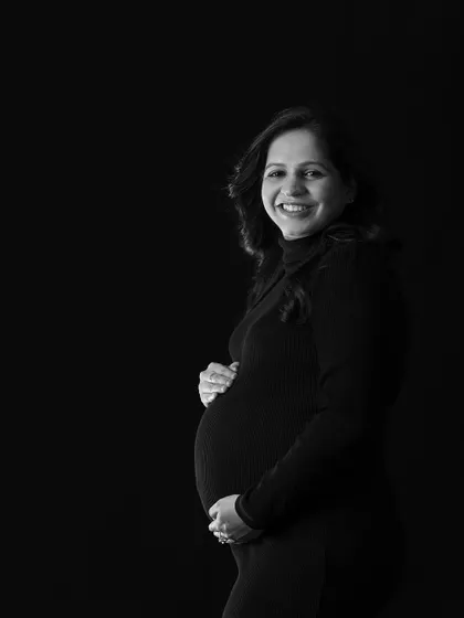 A simple, classic, and joyful monochrome portrait of the mother-to-be.