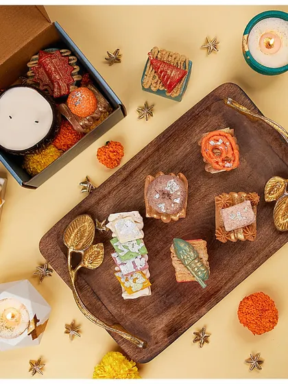 A beautiful flat-lay of my Mithai soaps on a wooden tray, showing the variety of shapes and colors.