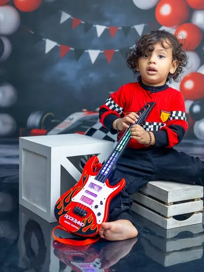 A rockstar in the making. This little boy's cool expression and the race-car-meets-rock-and-roll theme show how we can mix and match ideas to create something truly unique.