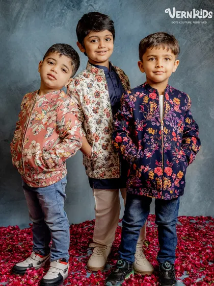 A trio of trendsetters. These boys model our popular floral bomber jackets, showing how they can be styled with jeans for a cool, casual-formal look.