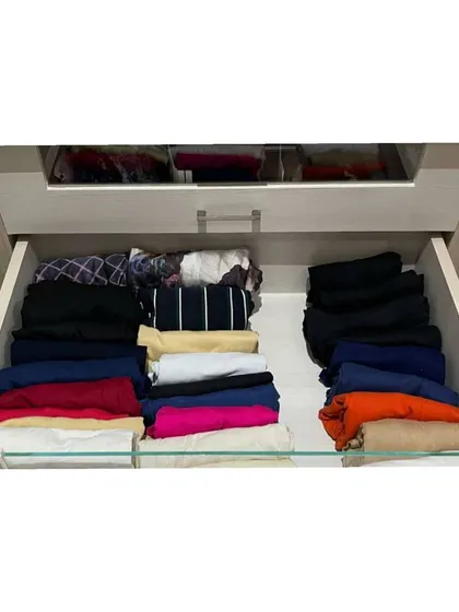 Another drawer from the same project, showing how we organized pants and other clothing items. The key is consistency in folding for a neat and tidy look.