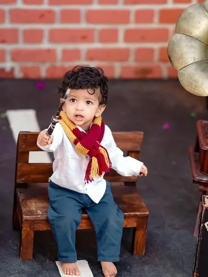For the little wizard in your life! Our Harry Potter theme is a magical experience, complete with a wand, scarf, and vintage props for a truly enchanting photoshoot.