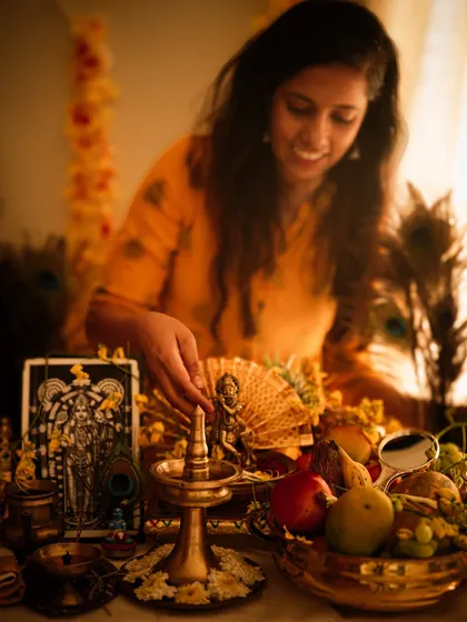 A personal moment of setting up the 'Vishu kani', a traditional arrangement of auspicious items for the new year in Kerala. The warm, gentle light captures the serene and hopeful spirit of the festival.
