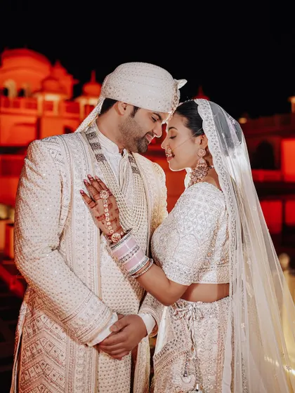 A close-up, intimate portrait of the couple, their faces close together, capturing the deep connection and happiness of their wedding night.