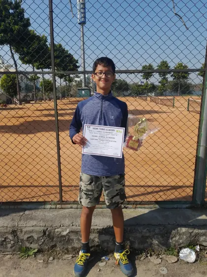 Riddhiman Ojha with his singles and doubles trophies from the Under-16 CS7 tournament in Rohtak. Securing both titles is an exceptional achievement on the AITA circuit.