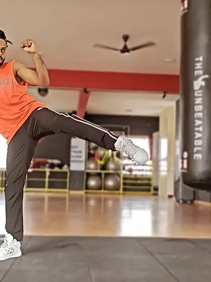 Hear that? That's Strong Nation cheering you on. A powerful side kick, demonstrating the martial arts influence in this high-intensity interval training program.