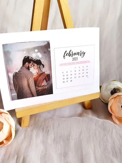 A personalized desk calendar for February 2023, featuring a romantic couple's photo. This makes for a thoughtful and practical gift that sits beautifully on any desk.