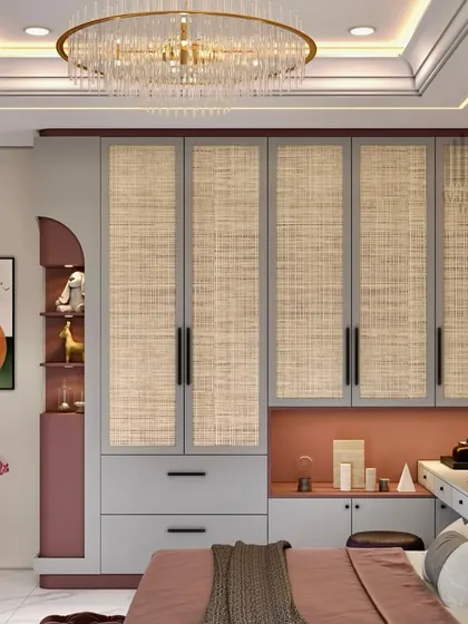 A luxurious bedroom design featuring a wardrobe with woven-textured doors, a built-in vanity, and a stunning crystal chandelier.