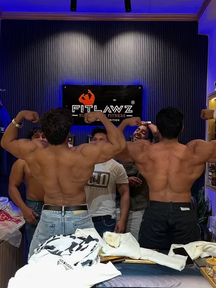 Back double biceps pose with my friend at the store.