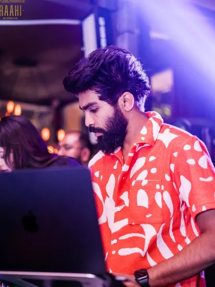"WHATEVER IT TAKES." A focused shot of me at the decks at Raahi, showing my dedication to the craft.
