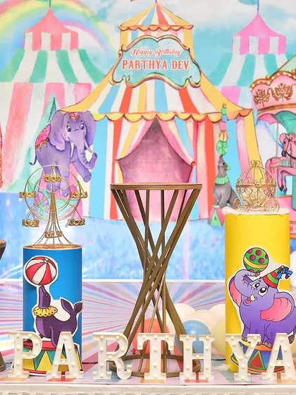 A vibrant and colorful carnival theme, with a circus tent backdrop and carousel animal cutouts.