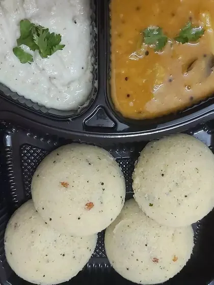 Start your day right with our authentic South Indian breakfast options. This meal box contains soft, fluffy idlis served with classic coconut chutney and aromatic sambar, delivered fresh from a home kitchen to your doorstep.