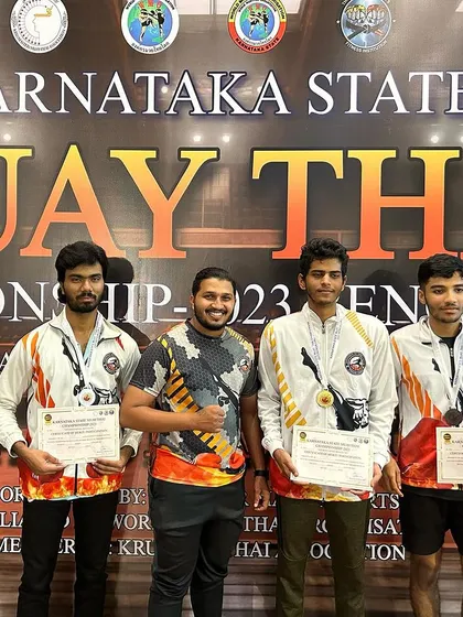 Posing with my medal winning fighters at the Karnataka State Muay Thai Championship. Their success is my success.