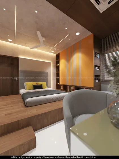A kids' bedroom with a raised platform bed and bright orange cabinetry. This design creates a playful, multi-level space.