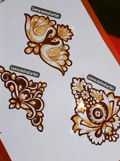 Three distinct motifs: a swan couple, an abstract floral, and a paisley-floral combination. Learning a library of these smaller designs is crucial for creating unique compositions.