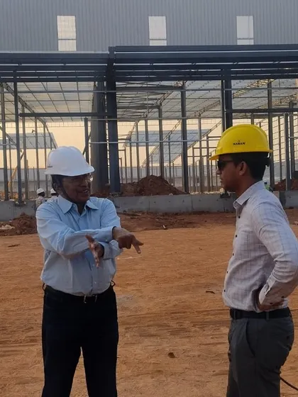 Discussing the layout and energy flow for a new industrial shed. Our early involvement with architects and builders ensures the structure is Vaastu-friendly from day one, preventing future obstacles.