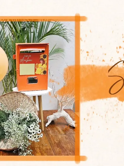 A 'wishing box' for a sunshine-themed baby shower, designed as a postbox where guests could leave messages for the parents-to-be.