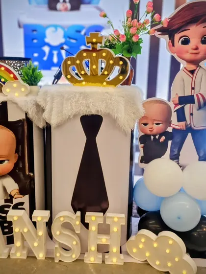 Detail shot of the Boss Baby themed pedestals with a light-up crown and character graphics.