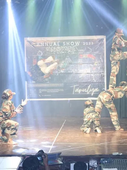 An impressive human pyramid formation from our army-themed patriotic dance performance.