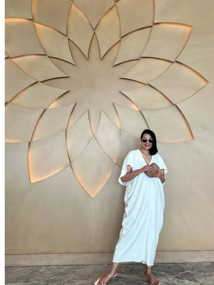 Effortless elegance in a simple white kaftan. This is a timeless piece that belongs in every resort wardrobe.