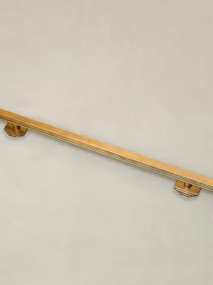 Our Natali Door Pull is a study in Art Deco geometry. The clean, stepped lines and strong vertical form create a handle that is both modern and timeless. It is available with both small and long backplate options to suit various door styles.
