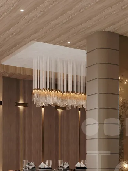 A detail of a crystal chandelier over a dining area, showcasing timeless design.