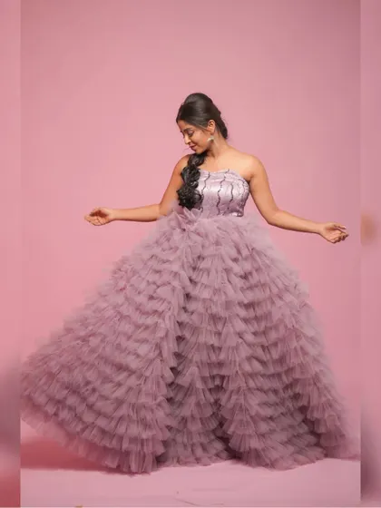 Twirling in the gorgeous multilayer net gown to show its full, fairytale-like volume.