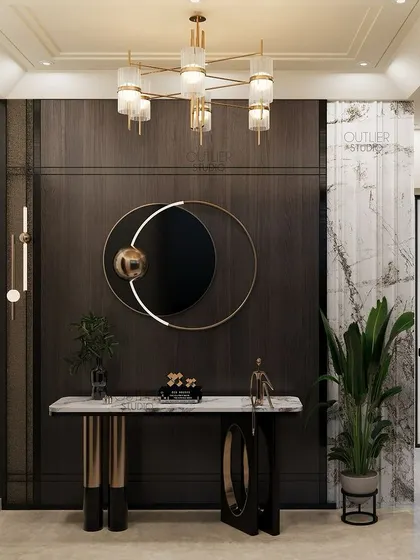 This foyer space sets the tone for the rest of the home. It features a dark wood paneled wall, a modern circular mirror, and a sleek console table, creating a sophisticated and welcoming entrance.
