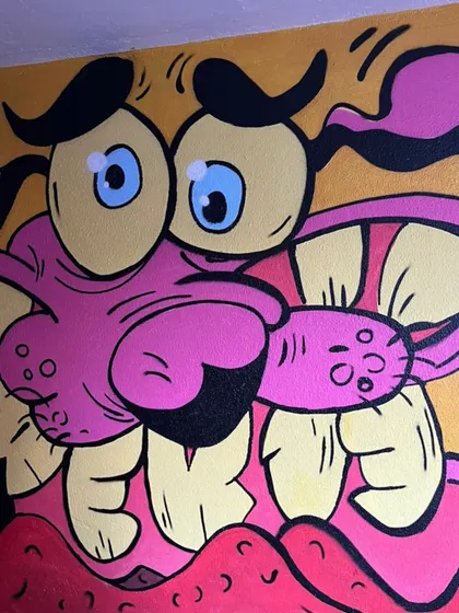 A close-up detail of the Courage mural, showing the textures and layers of paint.