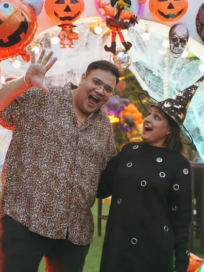 The parents deserve to have fun too. We capture the joy of the hosts and their guests, like this happy couple enjoying the Halloween party they threw for their son.