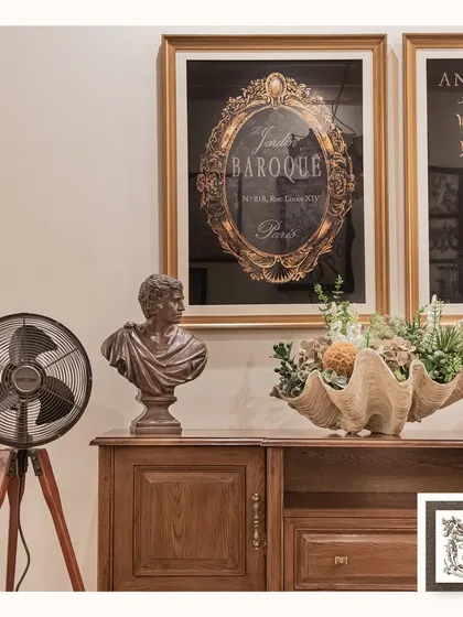 Here is another view of the wooden cabinet, showcasing its ample surface space and the warm, inviting atmosphere it helps create. It's a functional piece that anchors the room's decor.