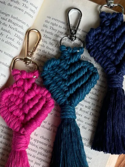 A trio of heart keychains in pink, teal, and navy blue. It's hard to pick a favorite!