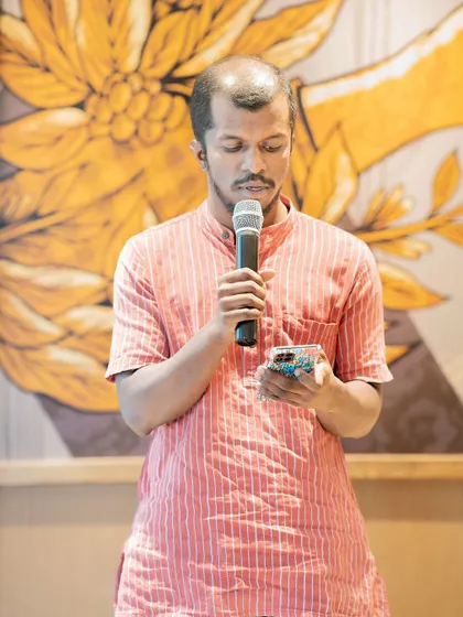 A poet performs at our "Voices of the Nation" themed event. This gathering celebrated India's Independence Day through poetry and stories.