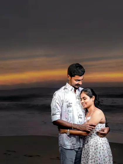A beautiful sunset shot from the same beach session, creating a warm and romantic silhouette against the evening sky.