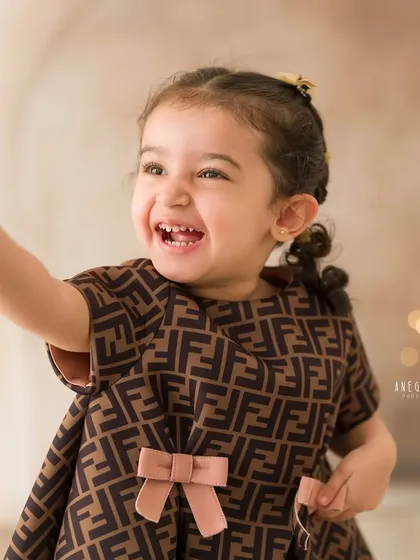 A moment of pure, uninhibited laughter. This candid shot captures the joyful spirit of childhood perfectly.