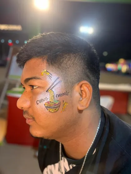 Another angle of the custom noodle bowl face paint, a fun and unique choice.