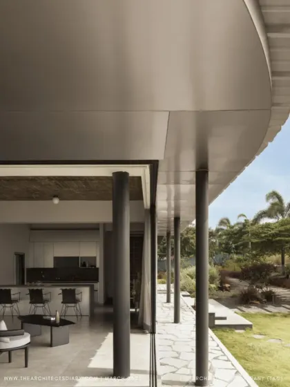 A feature spread from The Architect's Diary on Pavilion House, focusing on the seamless flow from the open-plan living area to the outdoor deck.