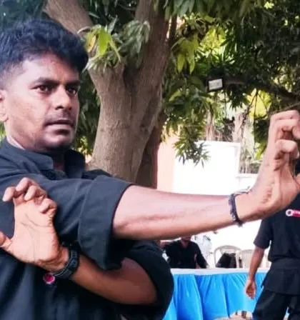 Demonstrating a hand position. Every detail, down to the placement of your fingers, is important in Kung Fu. This is the level of precision we strive for.