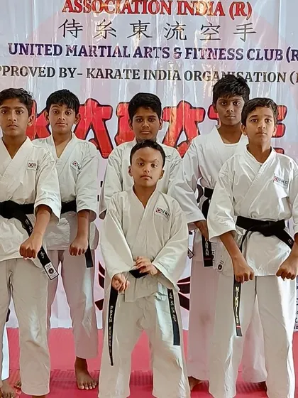 A group of our students after successfully passing their black belt exam.