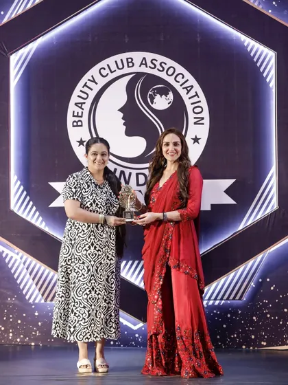 Feeling honored to receive an award from the Beauty Club Association, a recognition of my dedication and artistry.