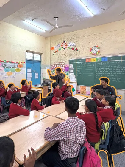 Our fellows work together to lead a session, creating a lively and interactive atmosphere. This classroom is filled with students eager to learn and participate in the musical activities.