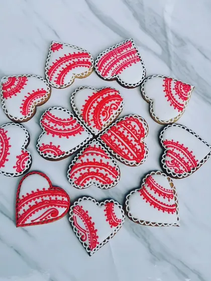Another angle of the red and white Valentine's Day sugar cookies. I really enjoy the precise piping work that goes into creating these intricate patterns.