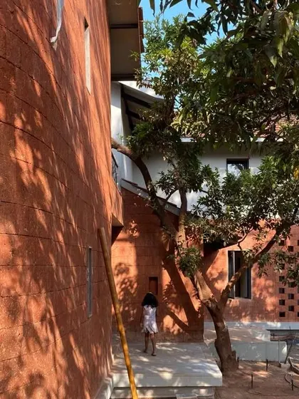 A work-in-progress shot of Maison Rouge, showing the beautiful texture of the laterite walls in the morning light. Building with local materials requires skill and care, and we love seeing it come together.