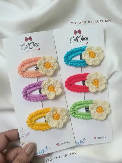 A variety of our floral and solid color crochet clips, showing the range of styles we offer.