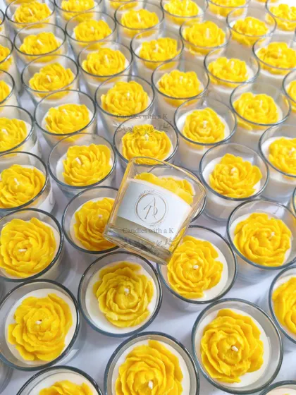 An overhead shot of the 200 stunning yellow peony votive candles, showing the scale and vibrant color of the Haldi order.