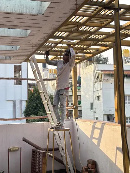 Balancing on a ladder to get the job done. Our team is dedicated to executing every detail, even when it requires a bit of creative acrobatics.