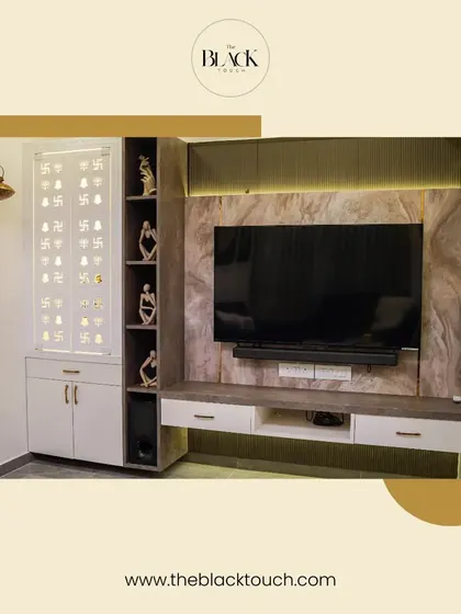 A well-designed entertainment and worship area. The TV unit features a marble-finish panel and is flanked by a beautiful mandir with jali-cut doors, blending modern needs with traditional values.