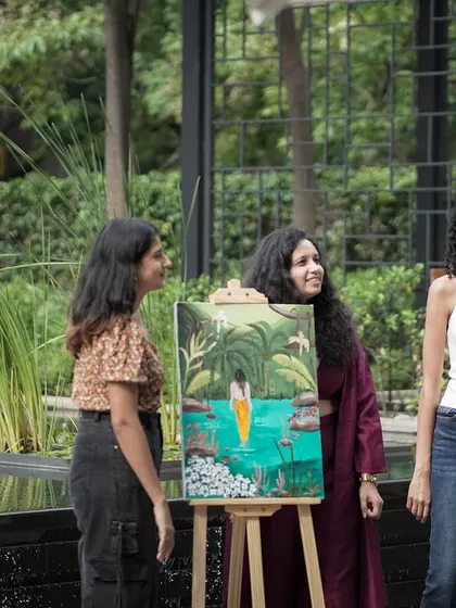 Chatting with guests about the finished painting at the Art N' Soul brunch at Four Seasons Bengaluru. It's always a joy to see how the artwork becomes a conversation starter among attendees.